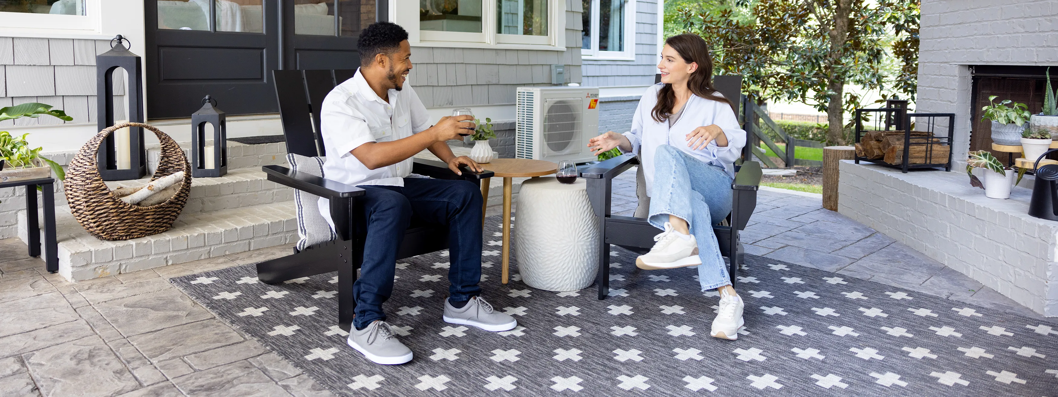 Couple enjoying quiet outdoor space with heat pump in operation