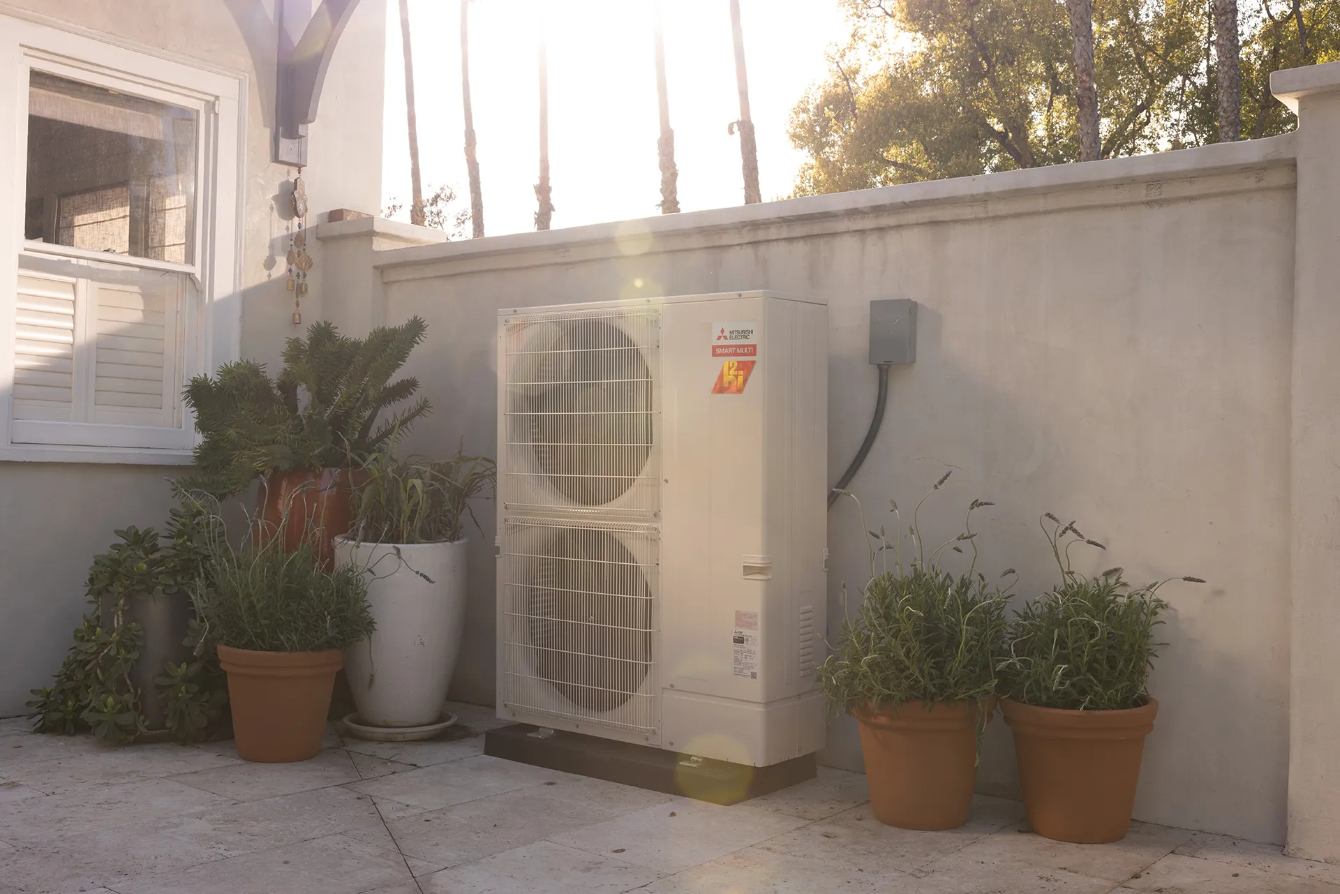 Outdoor heat pump unit in residential courtyard