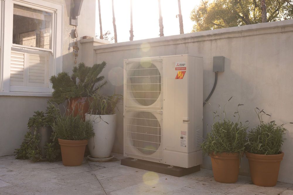 Outdoor heat pump installed in back of home