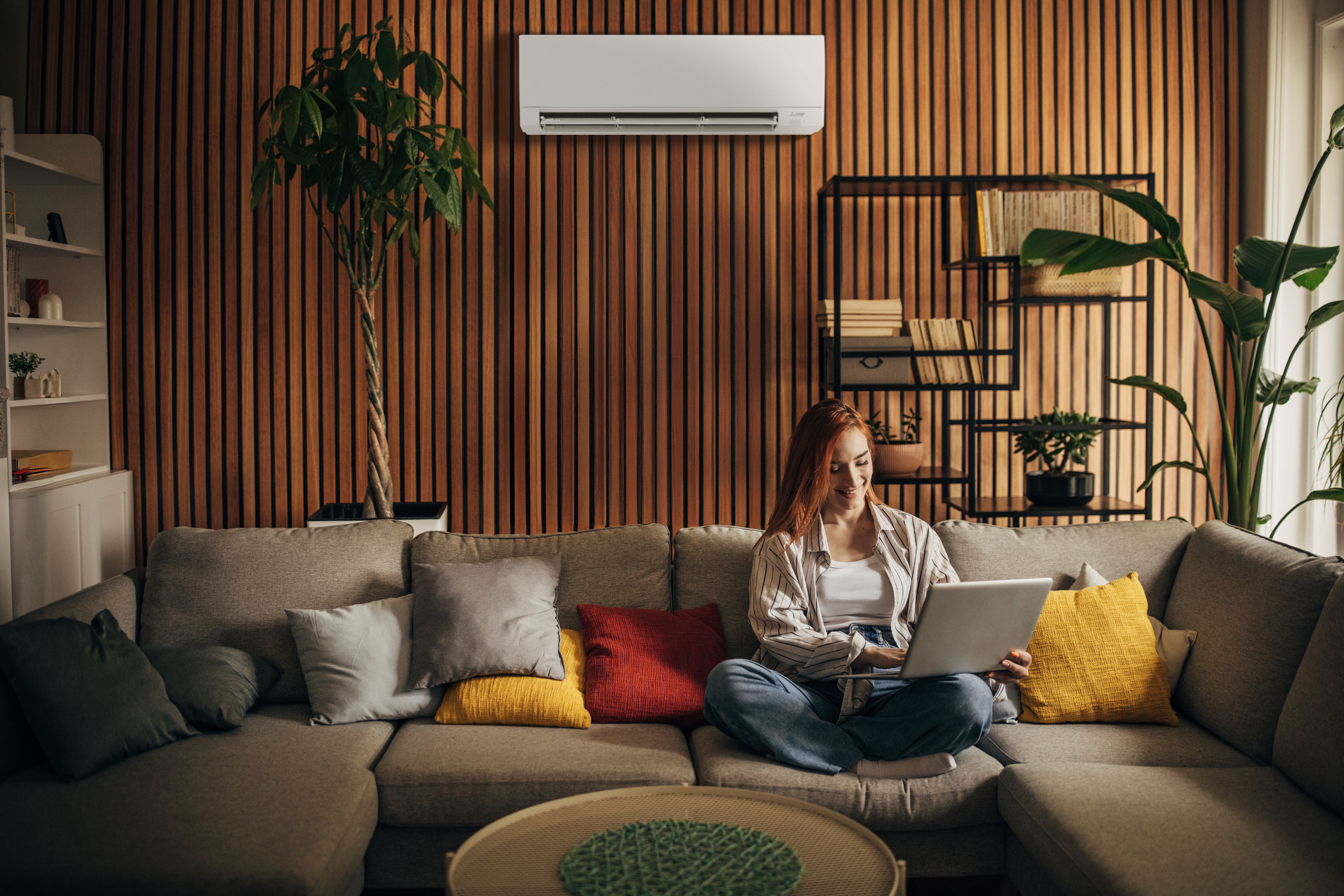 Woman working kept cool by GX premier cooling-only Wall-mounted indoor unit