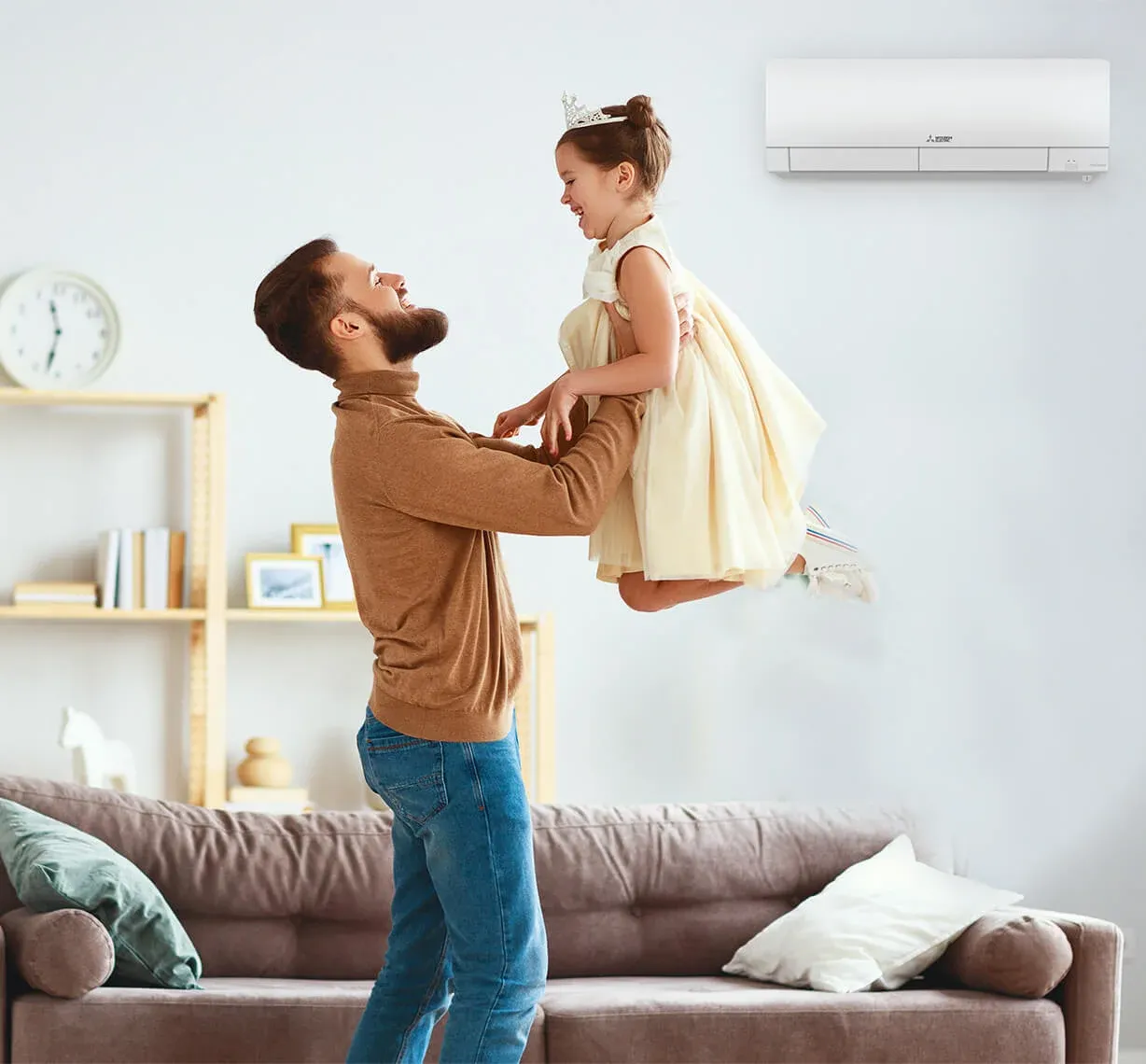 Mitsubishi Electric Trane HVAC father daughter mini-split wall unit in living room for clean and healthy air