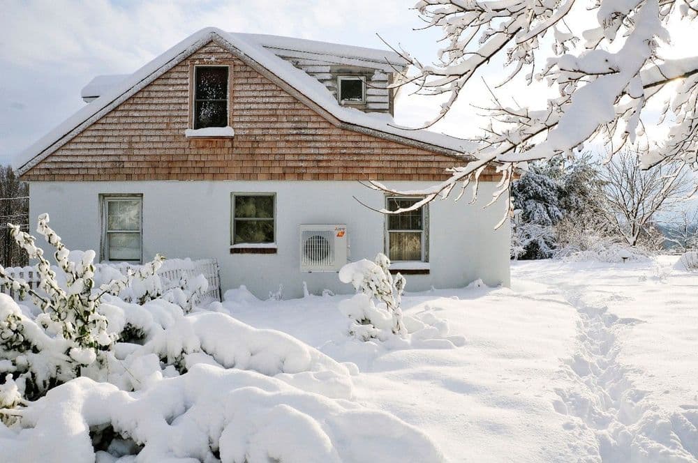 Family home covered in snow
