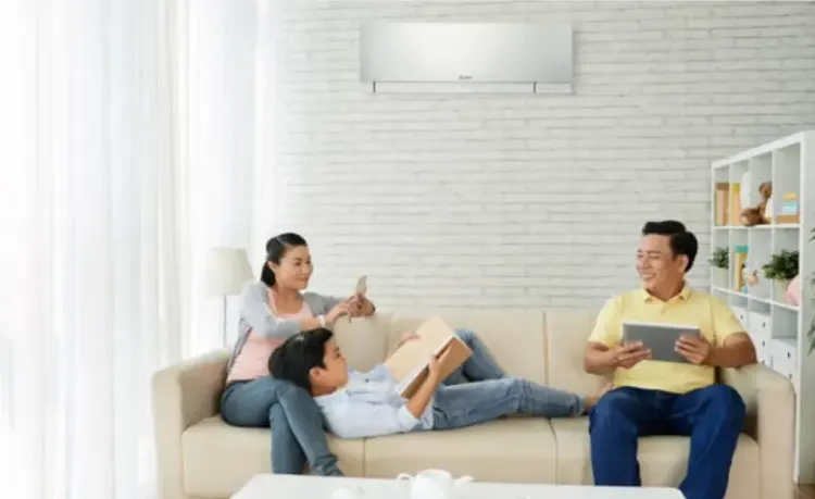 Breathe Easy in 2020 with Mitsubishi Electric!indoors man sofa adult woman togetherness room sit relaxation happiness family enjoyment seat facial expression people technology sitting leisure side view