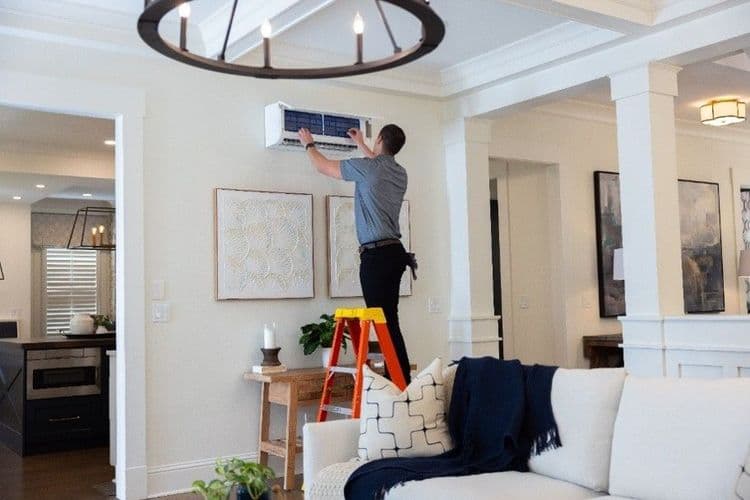 Contractor installing indoor wall unit