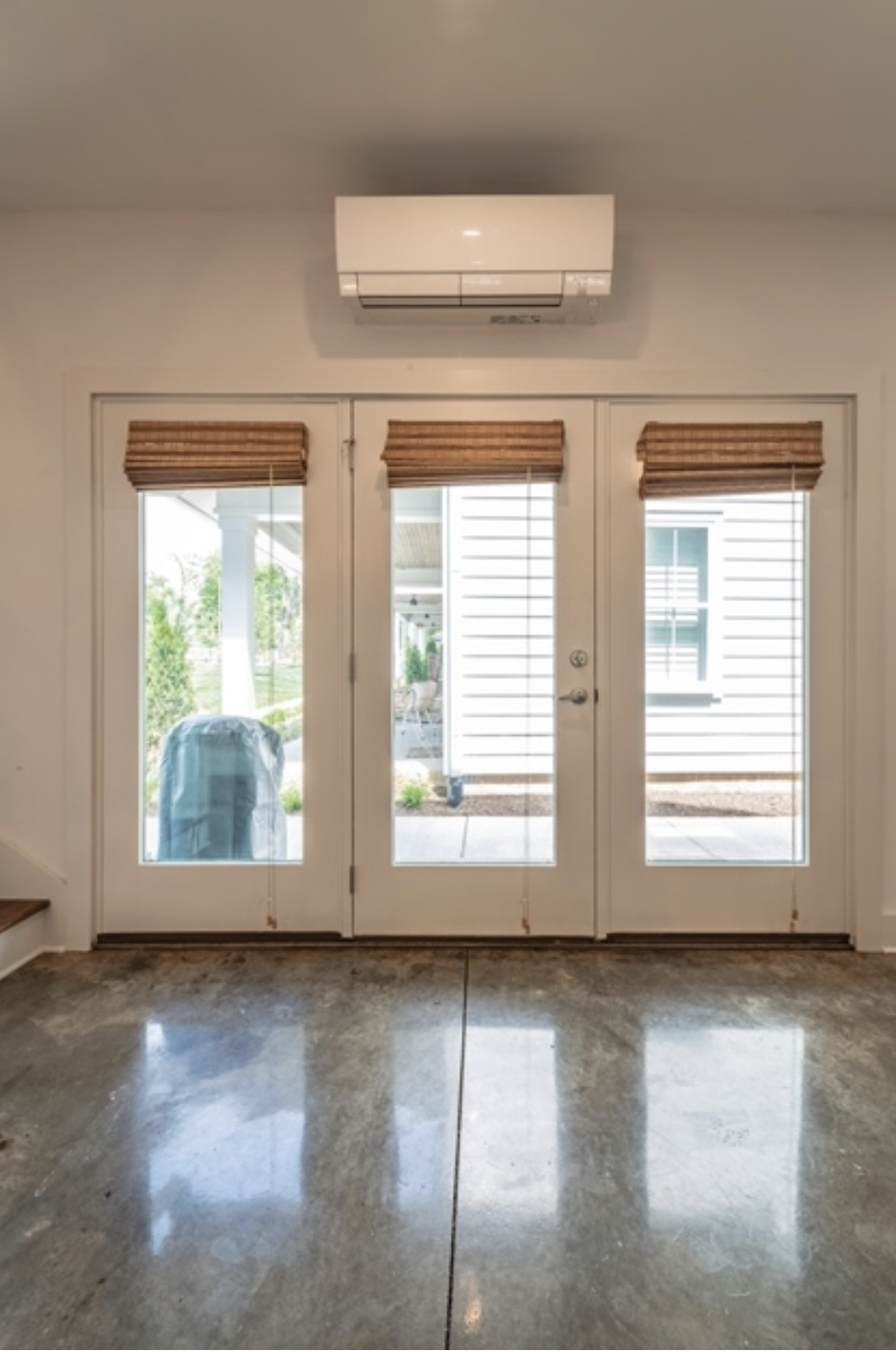 Image of french doors with a wall-mounted unit hanging above